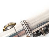 a close up of a flute that is on a white surface