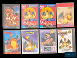 many pokemon cards on display on a black background