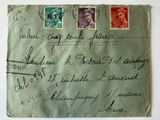 an old envelope with a stamp on it sitting on top of a table
