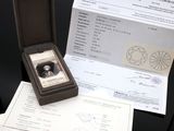 a small box with a ring inside of it on a table