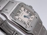 a close up of a wrist watch with roman numerals on it