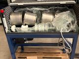 a large metal container with a bunch of items inside of it