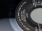 a record with a label on it sitting on a table