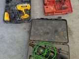 several tools are sitting in a case on the floor next to each other