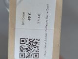 a bottle with a tag on it that has a qr code attached to it