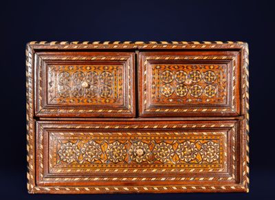 an old wooden chest of drawers with intricate carvings