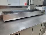 stainless steel counter top in a commercial kitchen with stainless steel cabinets