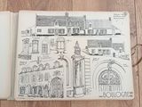 drawing of a book with a drawing of a building on it