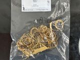 a bag of gold rings on a table next to a toilet