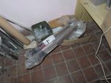 a box of tools sitting on the floor next to a wall