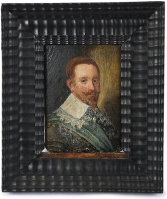 un vieux tableau représentant un homme barbu, dans un cadre noir