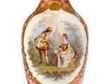 a pink vase with a picture of a man and a woman on it