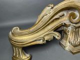 a gold bench that is sitting on a gray surface
