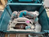 a blue tool box with a circular saw inside of it