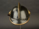 a helmet on a stand on a black background