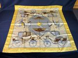 yellow and blue silk scarf with a picture of a bicycle and a carriage