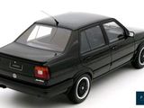 the car is black and has white rims on it