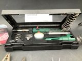 a box with tools in it sitting on a table