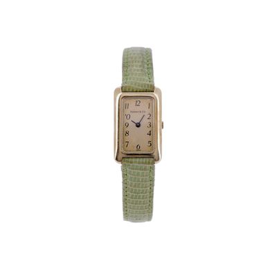 a watch that is sitting on a white surface