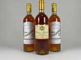 three bottles of wine sitting next to each other on a table