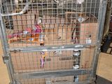 a metal cage with a bunch of boxes inside of it
