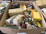 a cardboard box filled with lots of toys in it