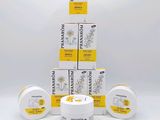 a stack of four boxes of sunflower cream sitting on top of each other