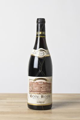a bottle of wine that is sitting on a table