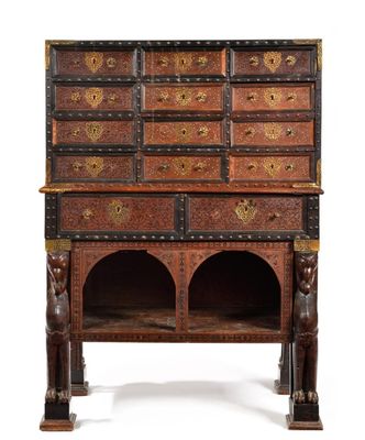 an old wooden cabinet with many drawers on top of it