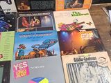a lot of records on a table in a room