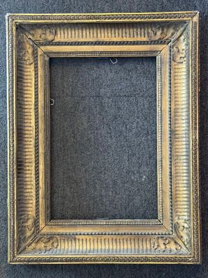 a gold picture frame with a black background