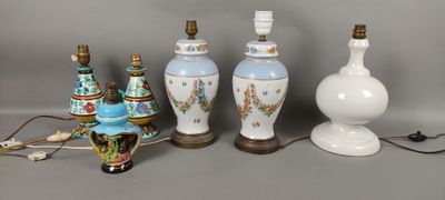 several different types of vases are lined up on a table