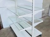 an image of a white shelf with glass shelves