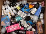 a box full of various types of makeup products