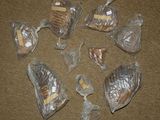 many bags of food sitting on the floor on the floor