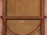 an old wooden picture frame with a red rope hanging from it ' s side
