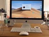 a computer on a desk with a keyboard and mouse