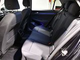 the back seats of a car with a blue light in the back