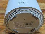 an image of a close up of a white device on a wooden table