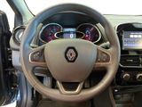 the interior of a car with a steering wheel and dashboard controls