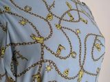 a mannequin dress with chains and skulls on it
