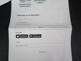 the receipt is sitting on top of a table next to a keyboard