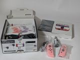 two nintendo wii controllers sitting in a box on a table
