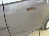 a car with a sticker on the side of it ' s door