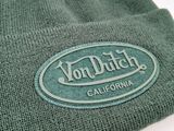 the hat is green and has a logo on it
