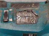 a close up of a blue machine with a label on it