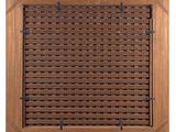 a close up of a wooden grille with a metal grill grate