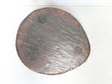 a close up of a toilet seat with a wooden lid