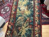 a rug on the floor with a picture of a bird on it