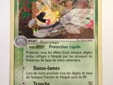a close up of a pokemon card on a white surface